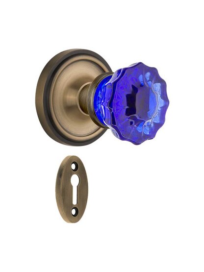 Classic Rosette Mortise Lock Set with Colored Fluted Crystal Glass Knobs Cobalt Blue in Antique Brass.